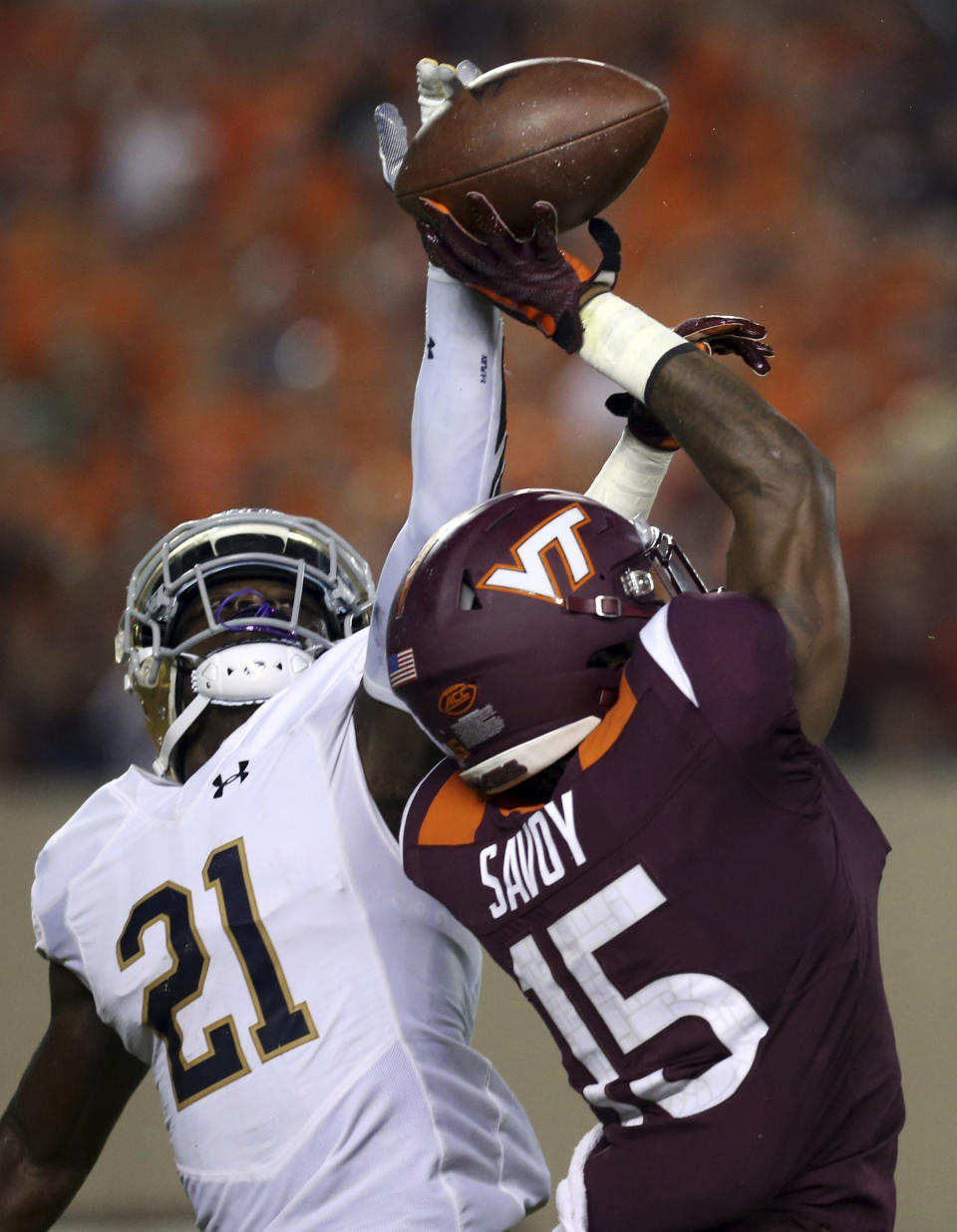 FILE - In this Oct. 6, 2018, file photo, Virginia Tech wide receiver Sean Savoy (15) has a pass from quarterback Ryan Willis (5) knocked away by Notre Dame defender Jalen Elliott (21) during the first half of an NCAA college football game in Blacksburg, Va. Notre Dame safeties Alohi Gilman and Jalen Elliott had 162 tackles, 12 passes defended and four forced fumbles between them. (Matt Gentry/The Roanoke Times via AP, File)
