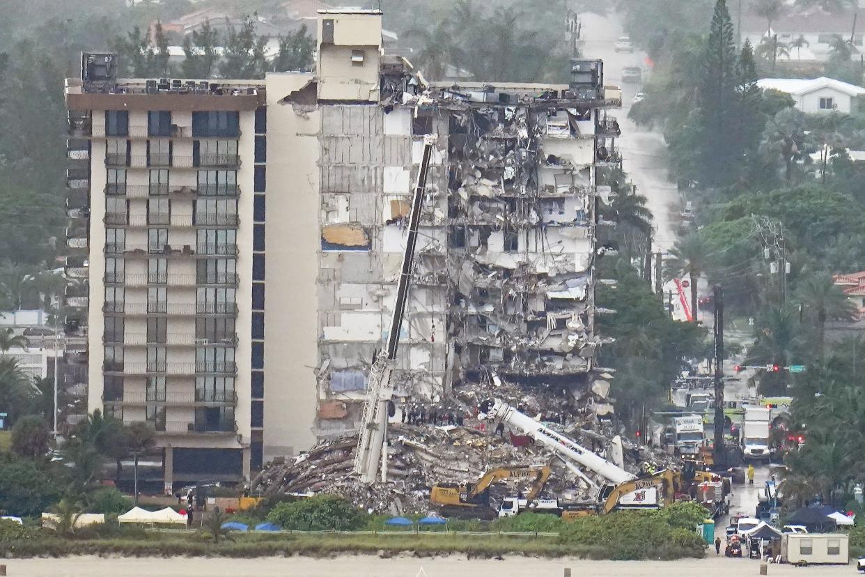 Workers search in the rubble at the Champlain Towers South Condo, Saturday, June 26, 2021, in Surfside, Fla. One hundred fifty-nine people were still unaccounted for two days after Thursday's collapse, which killed at least four.