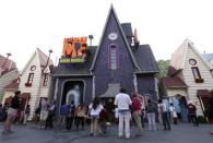 A crowd of people gather at the new "Despicable Me Minion Mayhem" ride during technical rehearsals for the new attraction at Universal Studios Hollywood in Universal City, California March 28, 2014. REUTERS/Jonathan Alcorn