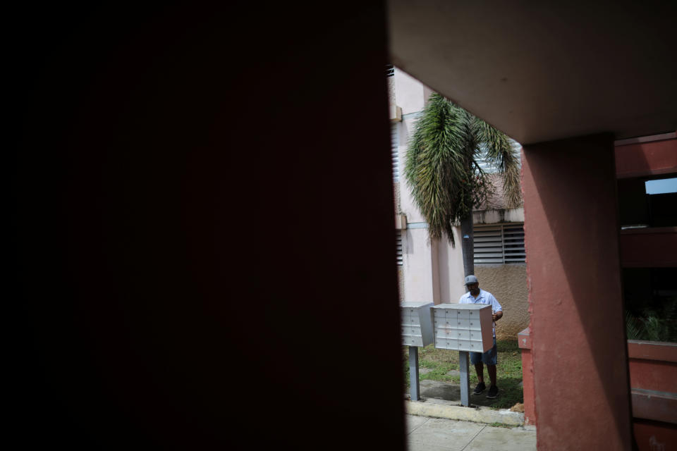 <p>Luis Menedez, a mail man for the U.S. Postal Service, delivers mail at an area affected by Hurricane Maria in the island of Vieques, Puerto Rico, Oct. 7, 2017. (Photo: Carlos Barria/Reuters) </p>