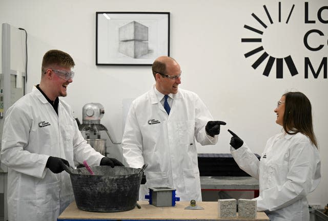 The Prince of Wales talks to chief executive and co-founder Natasha Boulding as he is shown part of the low carbon concrete manufacturing process during a visit to Low Carbon Materials in Seaham, County Durham