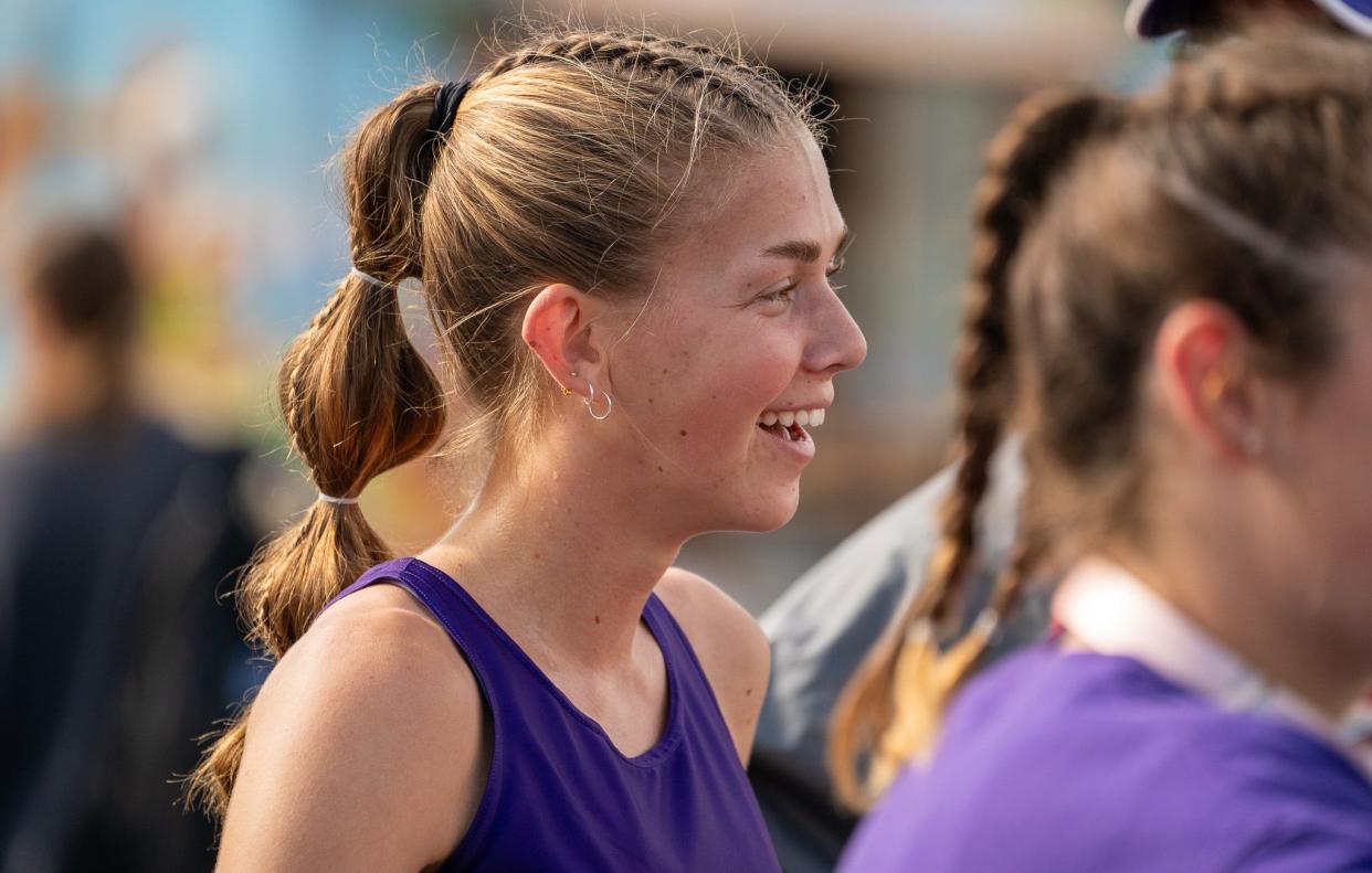 Lexington's Elyana Weaver is all smiles after winning the 400-meter dash on Friday night at the Marion Harding Night Invite.