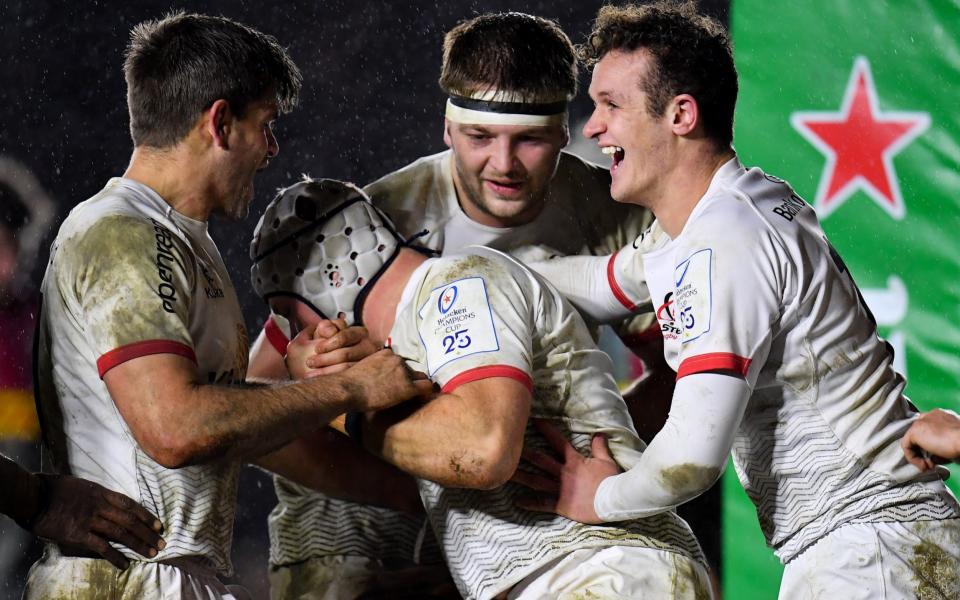 Luke Marshall of Ulster, centre, is congratulated by team-mates, from left, Louis Ludik, Iain Henderson and Billy Burns, after scoring his side's second try during the Heineken Champions Cup Pool 3 Round 4 match between Harlequins and Ulster at Twickenham Stoop in London, England. - GETTY IMAGES