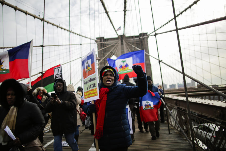 <p>People take part in a protest against President Donald Trump’s recent statements and words about immigration crossing the Brooklyn Bridge on Jan. 19, 2018 in New York. (Photo: Eduardo MunozAlvarez/VIEWpress/Corbis via Getty Images) </p>