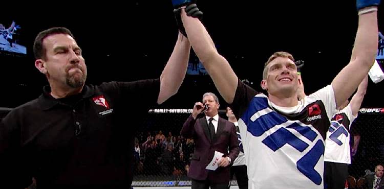 Stephen Thompson arm raised by John McCarthy