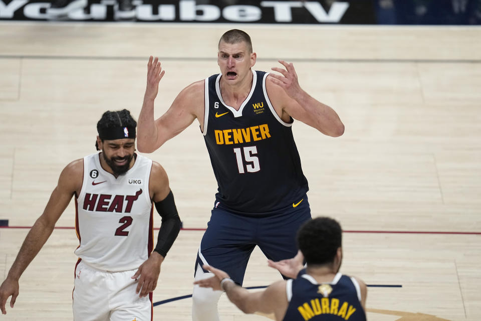 Denver Nuggets center Nikola Jokic (15) reacts during the second half of Game 2 of basketball's NBA Finals against the Miami Heat, Sunday, June 4, 2023, in Denver. (AP Photo/Mark J. Terrill)