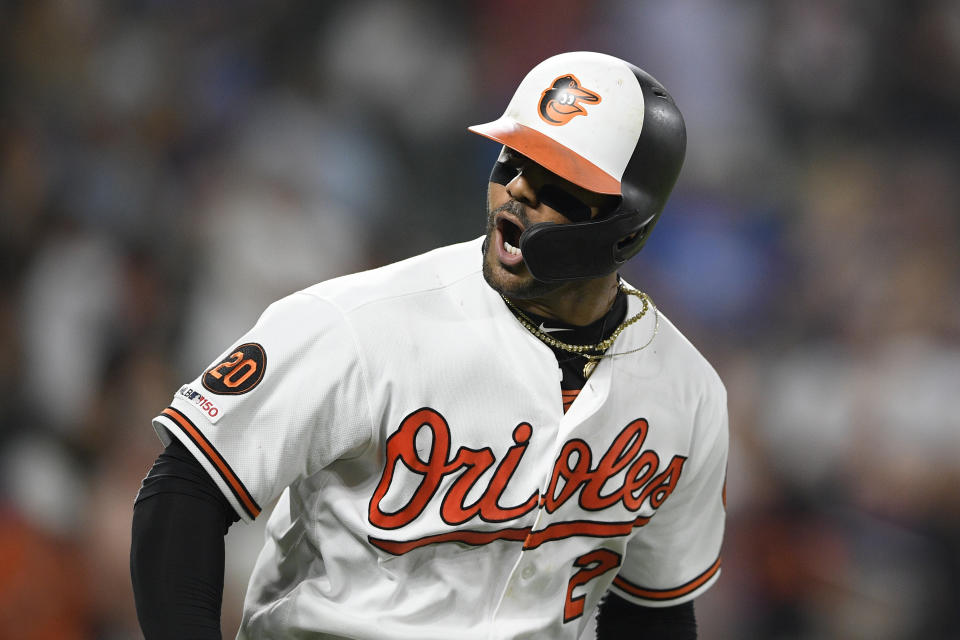 Baltimore Orioles' Jonathan Villar reacts towards the dugout after he hit a three-run home run during the seventh inning of the team's baseball game against the Los Angeles Dodgers, Wednesday, Sept. 11, 2019, in Baltimore. Villar connected for the 6,106th homer in the majors this season. That topped the mark of 6,105 set in 2017. The Orioles won 7-3. (AP Photo/Nick Wass)