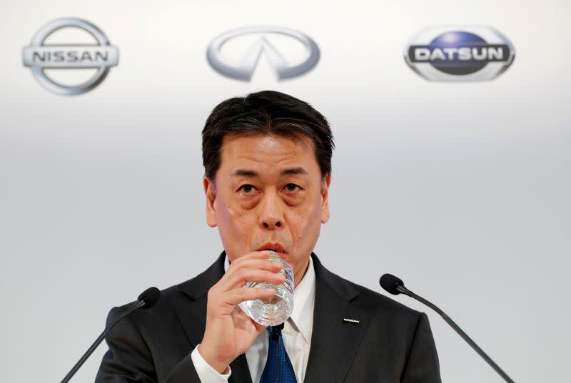 FILE PHOTO: Nissan Motor Co CEO Makoto Uchida drinks water during a news conference at the company's headquarters in Yokohama