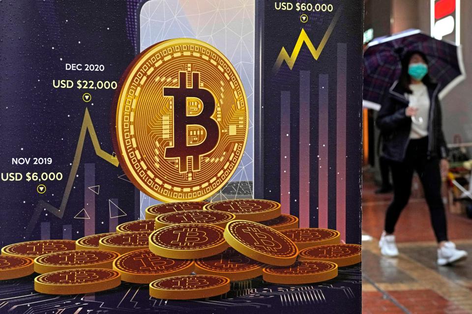 An advertisement for Bitcoin cryptocurrency is displayed on a street in Hong Kong on Feb. 17, 2022. Cryptocurrencies have experienced their worst plunge since 2018 in what industry leaders are referring to as a “crypto winter.”