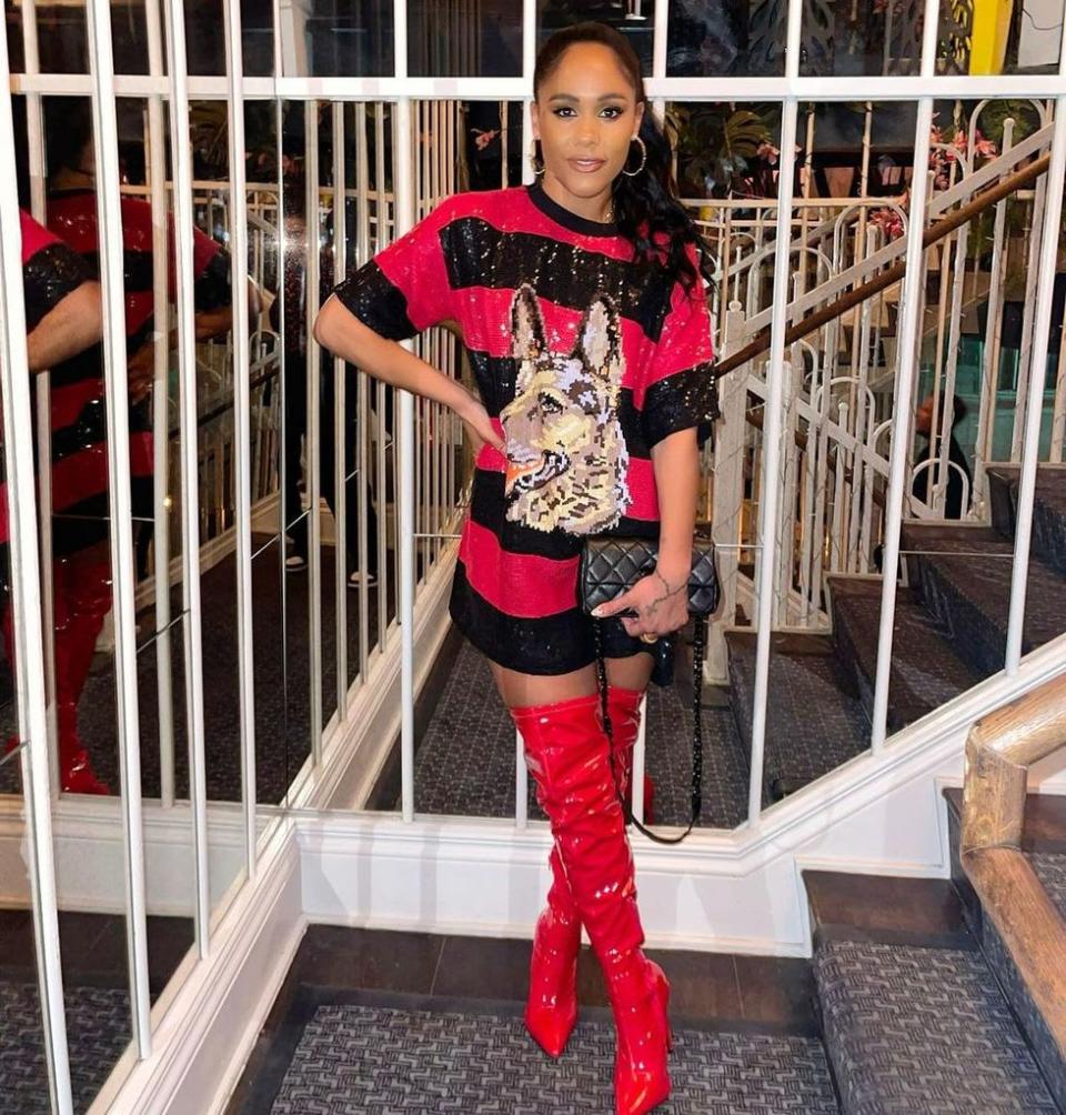 Alex Scott wore a glittering dress and red thigh-high boots