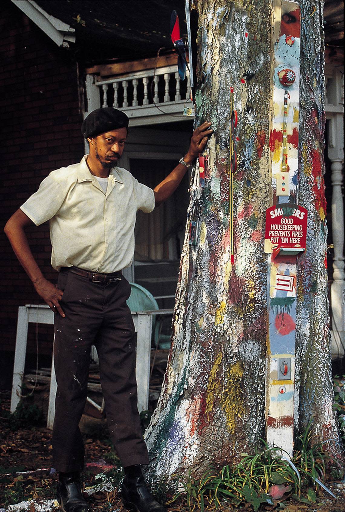 Charles Williams in front of one of his painted trees in Lexington.