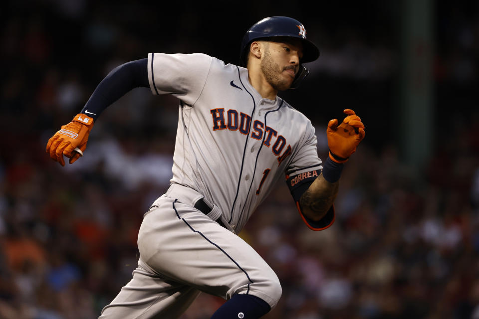Houston Astros' Carlos Correa runs out an RBI double against the Boston Red Sox during the second inning of a baseball game Tuesday, June 8, 2021, at Fenway Park in Boston. (AP Photo/Winslow Townson)