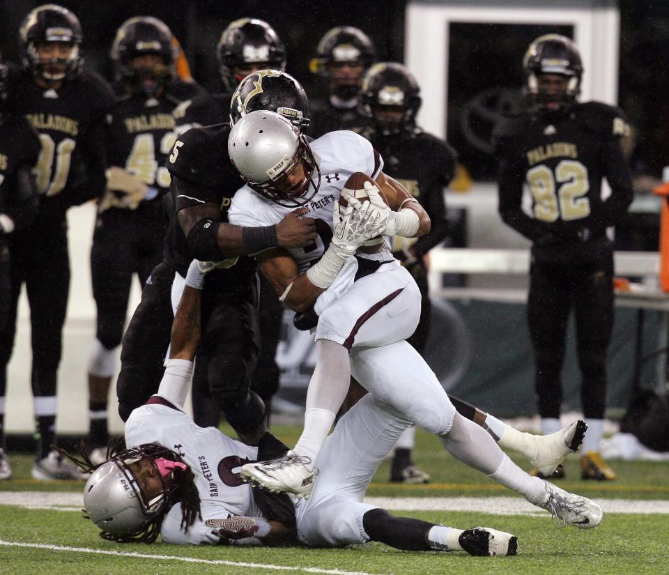 EAST RUTHERFORD, NJ 12/6/2013 -- NJSIAA Non-Public Group 4 football final, St. Peter's Prep vs. Paramus Catholic: St. Peter's #21 Minkah Fitzpatrick intercepts a pass intended for PC #5 Jabrill Peppers in first half at met MetLife Stadium. THOMAS E. FRANKLIN/THE RECORD