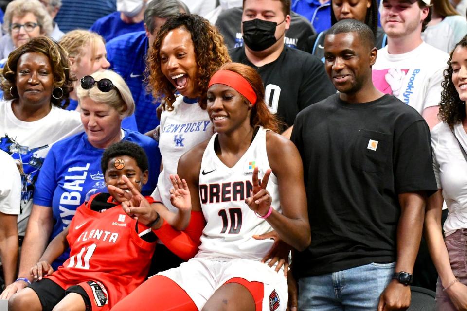 Atlanta rookie and No. 1 pick Rhyne Howard, who played at Kentucky, celebrates with her friends and family after the Atlanta Dream's win over the Indiana Fever at Gainbridge Fieldhouse in Indianapolis on May 15, 2022.