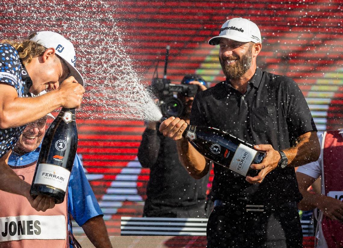 Cameron Smith, left, and Dustin Johnson celebrate after competing in the LIV Golf Team Championship at Trump National Doral Golf Club on Oct. 30, 2022, in Doral.