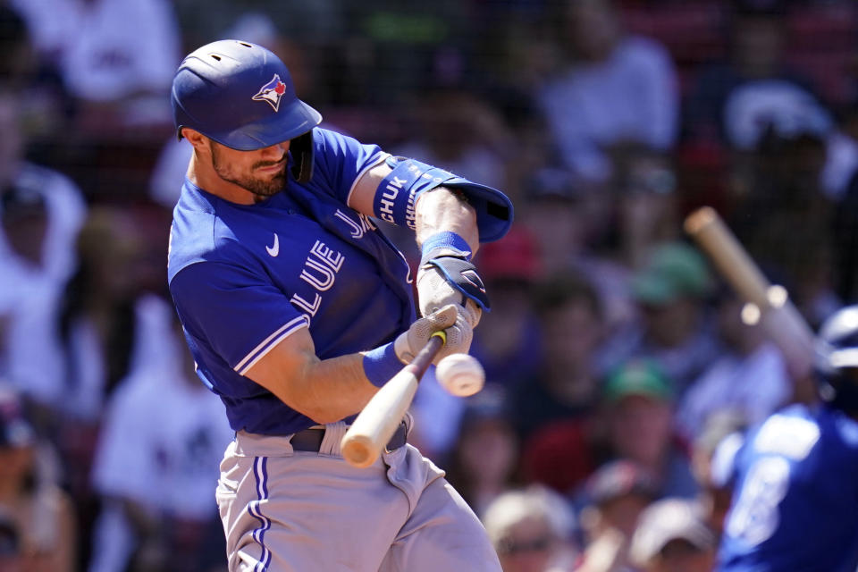 Toronto Blue Jays' Randal Grichuk connects for a two-run home run of Boston Red Sox starting pitcher Garrett Richards in the fourth inning of a baseball game at Fenway Park, Wednesday, July 28, 2021, in Boston. (AP Photo/Charles Krupa)