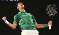 Serbia's Novak Djokovic celebrates after defeating United States' Talyor Fritz in their third round match at the Australian Open tennis championship in Melbourne, Australia, Saturday, Feb. 13, 2021.(AP Photo/Andy Brownbill)