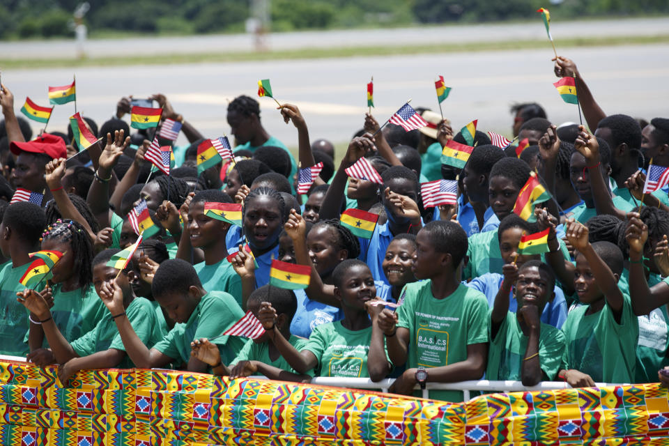 School children wait for there arrival of U.S. Vice President Kamala Harris at Kotoka International Airport in Accra, Ghana Sunday, March 26, 2023. Harris is on a seven-day African visit that will also take her to Tanzania and Zambia. (AP Photo/Misper Apawu)