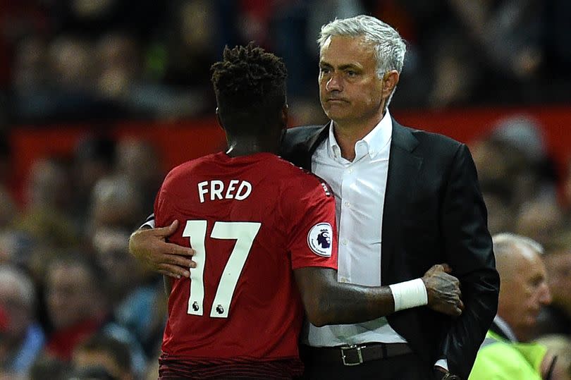 Jose Mourinho (R) gestures with Fred