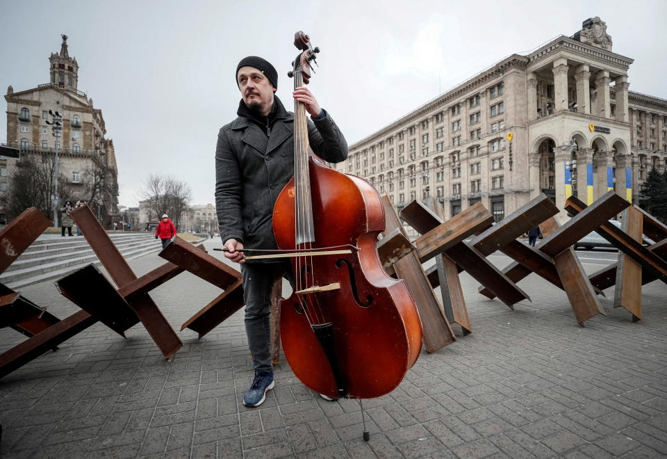 Oleksey Beregoviy, a musician of the Kyiv-Classic Symphony Orchestra, performs for journalists and people after an open-air concert named 