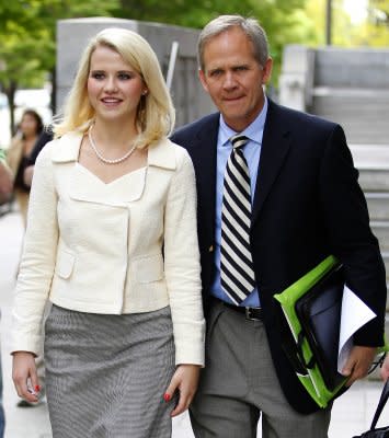 Elizabeth Smart and her father, Ed, leaving court after the sentencing of her kidnapper. (Photo by George Frey/Getty Images) 