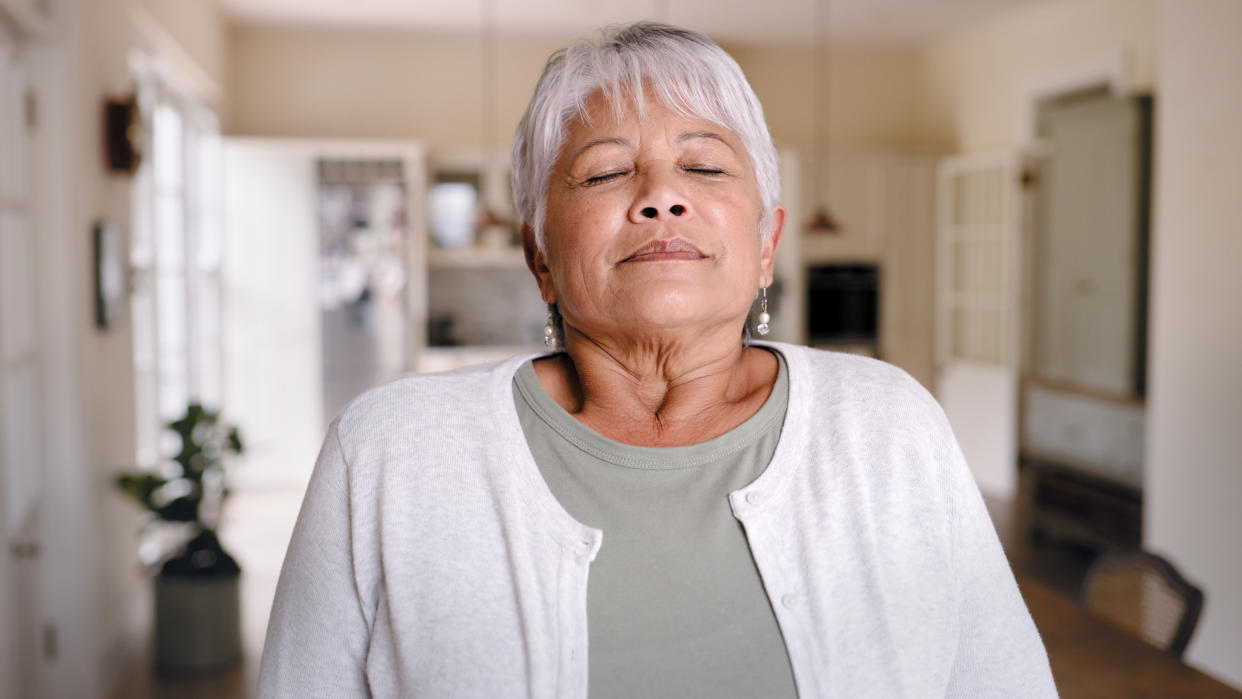 Older woman breathing slowly. 