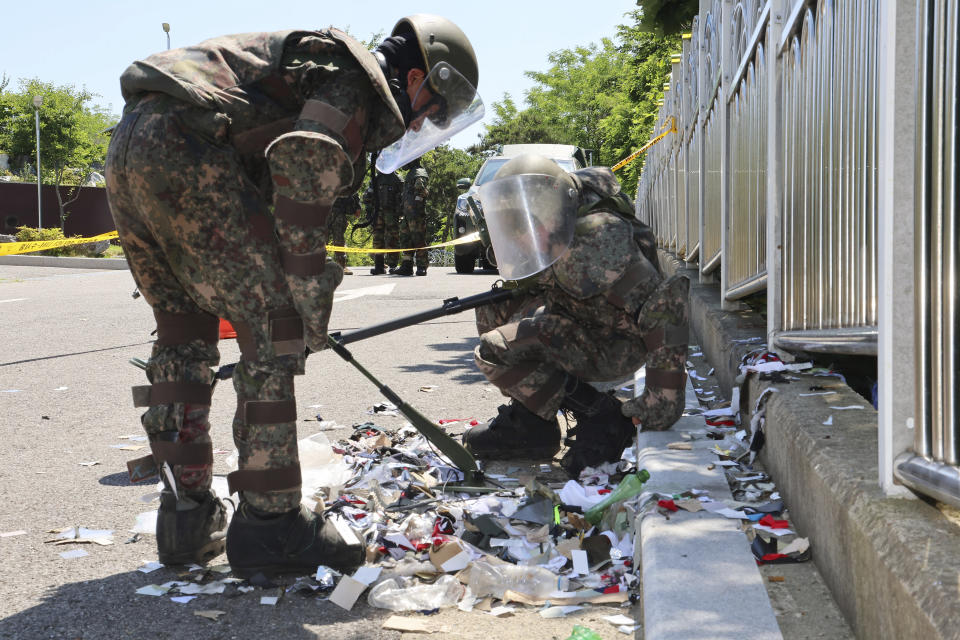 FILE - South Korean soldiers wearing protective gears check the trash from a balloon presumably sent by North Korea, in Incheon, South Korea, on June 2, 2024. South Koreans were alert Friday, June 7, 2024 for possible new launches by North Korea of balloons carrying rubbish into the South, a day after Seoul activists flew their own balloons to scatter political leaflets in the North. (Im Sun-suk/Yonhap via AP, File)