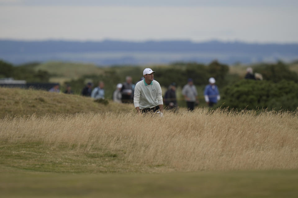 Scottie Scheffler of the US after playing a shot on the 14th fairway during the third round of the British Open golf championship on the Old Course at St. Andrews, Scotland, Saturday July 16, 2022. (AP Photo/Alastair Grant)