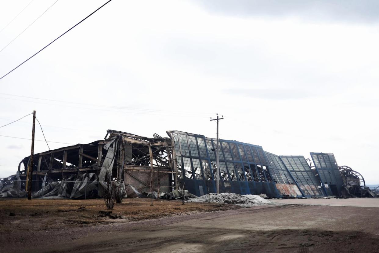 After a fire tore through former airport hangar in Happy Valley-Goose Bay, on Saturday mayor George Andrews said the state of emergency had been lifted and people could return to their homes. (Heidi Atter/CBC - image credit)