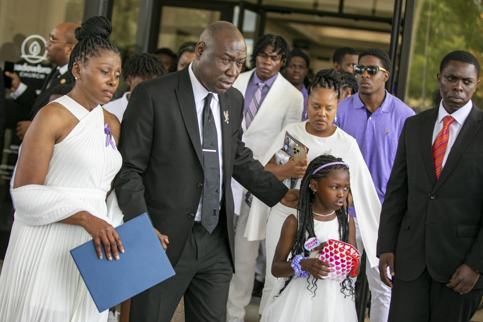 FILE - Pamela Dias, the mother of Ajike Owens, left, attorney Ben Crump and Africa Owens leave after the funeral for Ajike Owens, Monday, June 12, 2023, at Meadowbrook Church in Ocala, Fla. Susan Louise Lorincz, the white woman accused of firing through her door and fatally shooting Ajike Owens in front of her 9-year-old son in central Florida, was charged Monday, June 26, with manslaughter and assault. (AP Photo/ Alan Youngblood, File)