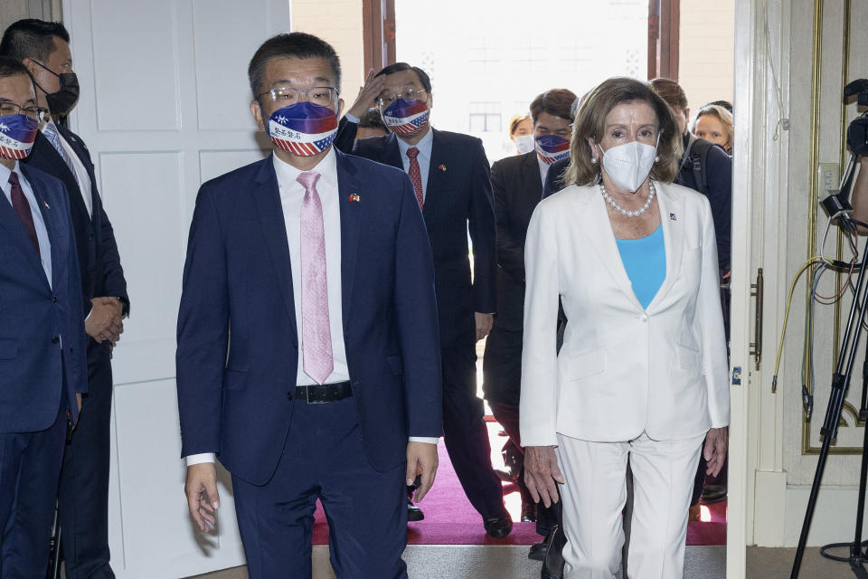 FILE - In this photo released by the Taiwan Legislative Yuan, U.S. House Speaker Nancy Pelosi, right, and Legislative Yuan Deputy Speaker Tsai Chi-chang arrive for a meeting in Taipei, Taiwan, Wednesday, Aug. 3, 2022. China announced Tuesday, Aug. 16, 2022, is imposing visa bans and other sanctions on a number of Taiwanese political figures including Tsai over their promotion of the self-governing island democracy's independence from Beijing. (Taiwan Presidential Office via AP, File)