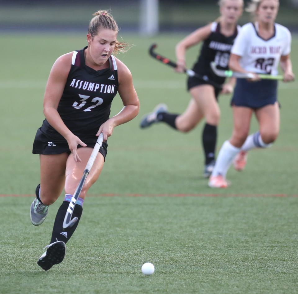 Assumption’s Tyler Everslage moves the ball against Sacred Heart in the Apple Tournament Field Hockey Championship.Aug 26, 2022