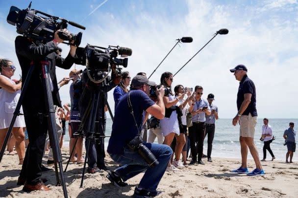 PHOTO: President Joe Biden speaks with reporters during a walk on the beach with family members near Gordons Pond in Cape Henlopen State Park, Rehoboth Beach, Delaware, on June 20, 2022. (Elizabeth Frantz/Reuters)