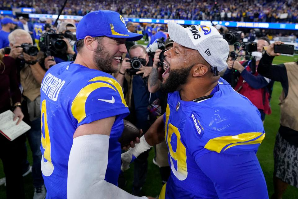 Rams QB Matthew Stafford, left, and defensive lineman Aaron Donald celebrate after the Rams' 20-17 win in the NFC championship game on Sunday, Jan. 30, 2022, in Inglewood, California.