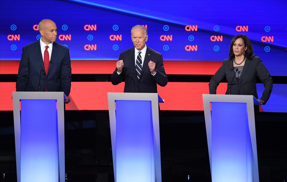 Democratic presidential hopefuls (L-R) US Senator from New Jersey Cory Booker, Former Vice President Joe Biden and US Senator from California Kamala Harris speak during the second round of the second Democratic primary debate of the 2020 presidential campaign season hosted by CNN at the Fox Theatre in Detroit, Michigan on July 31, 2019.