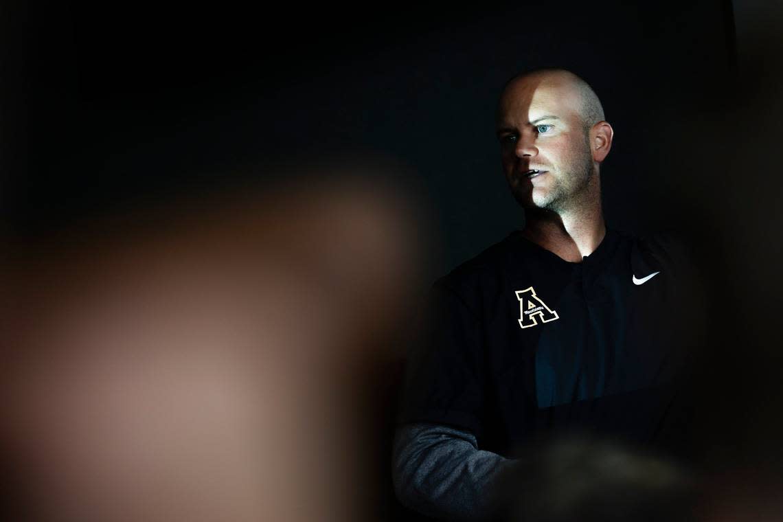 Appalachian State offensive coordinator/quarterbacks coach Kevin Barbary gives instructions to players during a meeting at Kidd Brewer Stadium in Boone, N.C., Tuesday, Aug. 30, 2022.