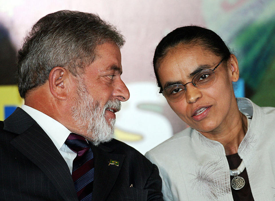 Brazilian President Luiz Inacio Lula da Silva (L) and Enviroment Minister Marina Silva talk after signing a decree to promote sustainable development in the public forest, 02 March, 2006, in Brasilia.<span class="copyright">Evaristo Sa—AFP/Getty Images</span>