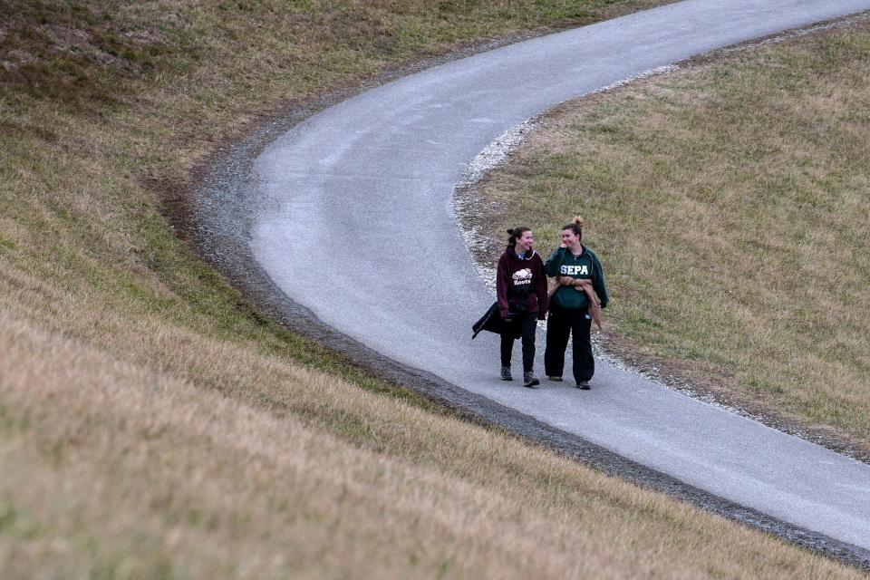 Residents enjoy a walk on Steven Amick Trail exiting the Newark Reservoir in Newark, Del., Sunday, Jan. 29, 2023.