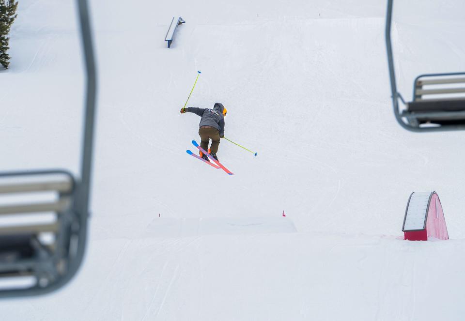 A skier catches some air in the terrain park at Showdown on March 18, 2020.