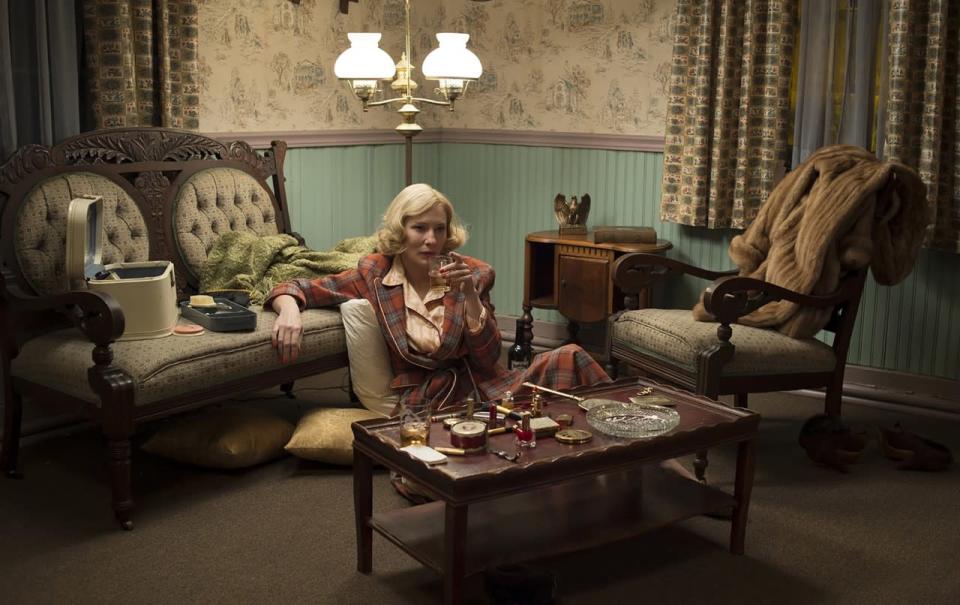 Cate Blanchett wears a plaid robe in Carol. 