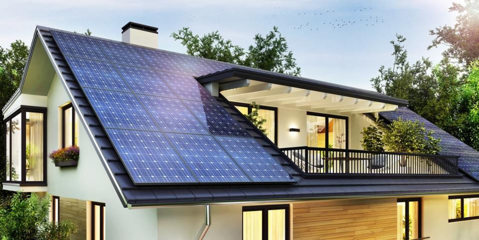 top of house with solar panels and balcony with plants