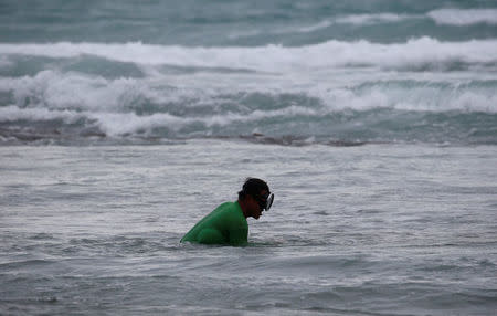 A man fishes amidst bad weather as Typhoon Haima struck Pagudpud, Ilocos Norte, in northern Philippines, October 20, 2016. REUTERS/Erik De Castro