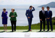 <p>British Prime Minister Theresa May, German Chancellor Angela Merkel, Canada’s Prime Minister Justin Trudeau, France’s President Emmanuel Macron and Japanese Prime Minister Shinzo Abe wait for President Donald Trump to join them for a family photo at the G7 Summit in Charlevoix, Quebec, Canada, June 8, 2018. (Photo: Leah Millis/Reuters) </p>