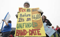 <p>A teacher holds a protest sign at the state Capitol on April 2, 2018, in Oklahoma City. (Photo: J Pat Carter/Getty Images) </p>