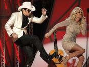 Hosts Brad Paisley and Carrie Underwood dance "Gangnam style" at the 46th Country Music Association Awards in Nashville, Tennessee, November 1, 2012. REUTERS/Harrison McClary (UNITED STATES - Tags: ENTERTAINMENT TPX IMAGES OF THE DAY) 