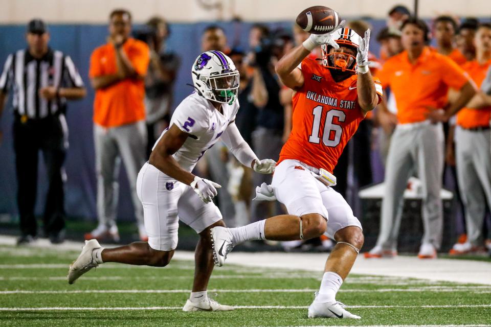 Sep 2, 2023; Stillwater, Oklahoma, USA; Oklahoma State's Josiah Johnson (16) catches a pass in the third quarter during an NCAA football game between Oklahoma State and Central Arkansas at Boone Pickens Stadium. Mandatory Credit: Nathan J. Fish-USA TODAY Sports