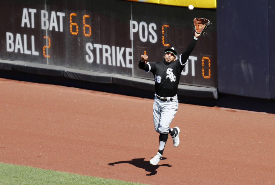 Chicago White Sox right fielder Leury Garcia (28) leaps for a run-scoring sacrifice fly hit by New York Yankees' Kyle Higashioka during the seventh inning of a baseball game, Saturday, April 13, 2019, in New York. The Yankees' Greg Bird scored on the play. (AP Photo/Kathy Willens)