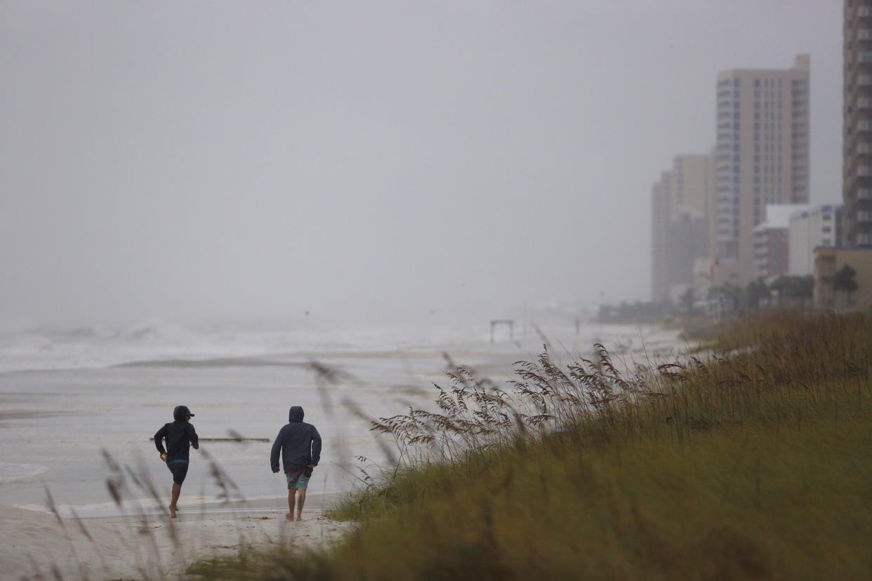 People on the beach in Panama City Beach, Fla,, ahead of Hurricane Michael on Oct. 10. (Photo: Getty Images/Luke Sharrett/Bloomberg)