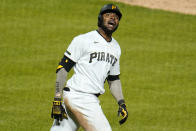 Pittsburgh Pirates' Gregory Polanco celebrates as he runs to first base after driving in the winning run with a sacrifice fly off San Francisco Giants relief pitcher Caleb Baragar during the 11th inning of a baseball game in Pittsburgh, Friday, May 14, 2021. The Pirates won 3-2. (AP Photo/Gene J. Puskar)