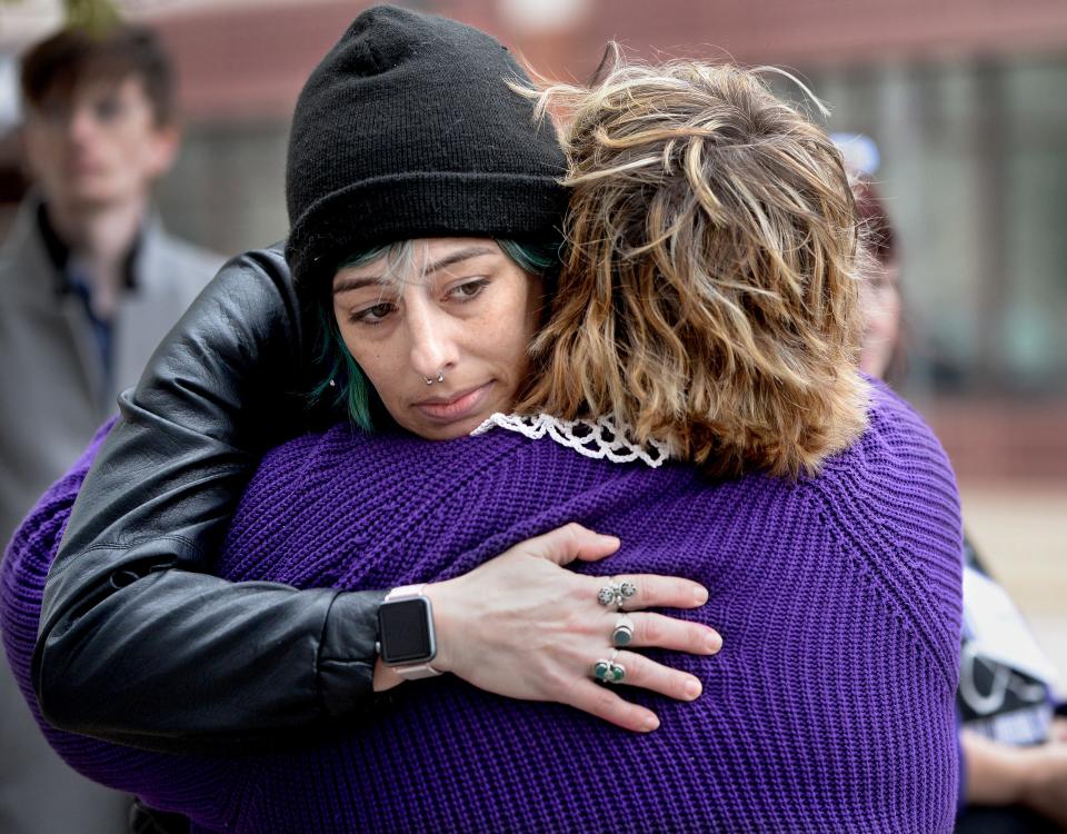 Jessica Loforte, left, gets a hug from Tracy Owens, a co-founder of The Resistor Sisterhood, a Springfield-based activist group, after Loforte shared her life experiences during a protest in front of the federal courthouse in Springfield supporting abortion access Tuesday.